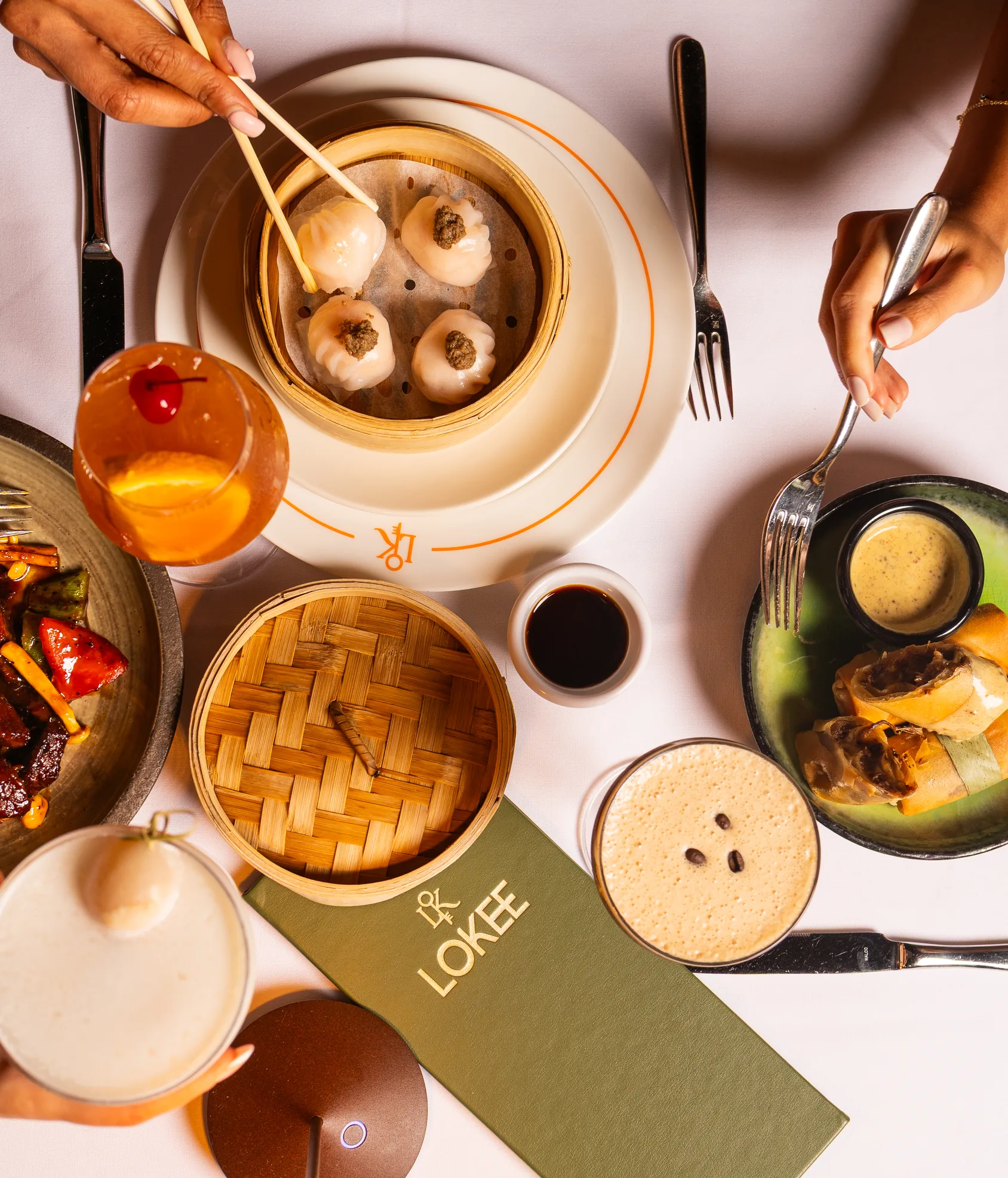 Lo Kee dinner spread with dim sum and signature dishes