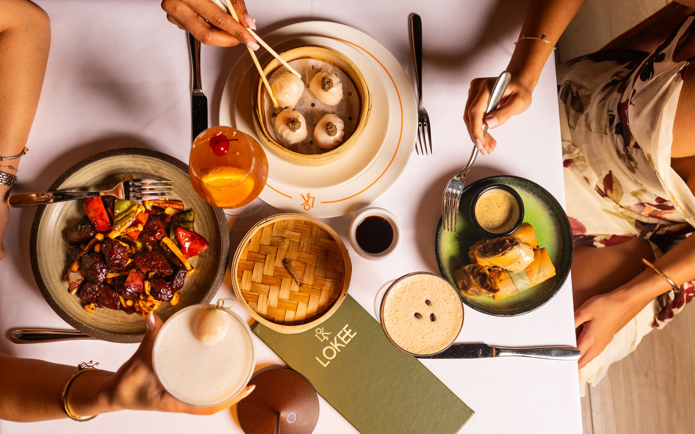 Dim sum, spring rolls and cocktails shared at a Lo Kee table